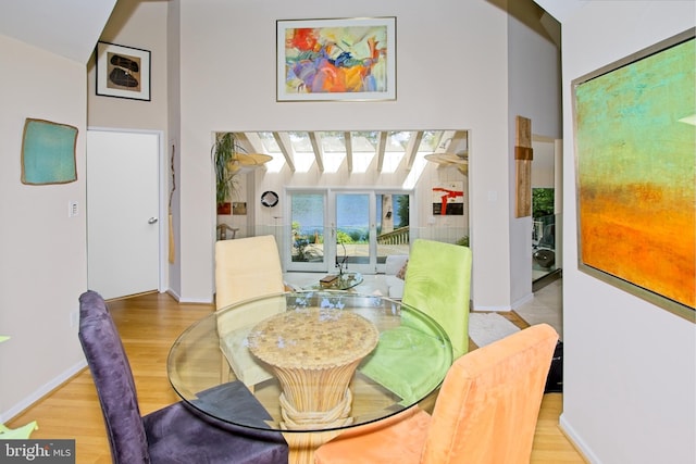 11566 Lake Newport Rd, Reston, VA 20194 - dining space with wood finished floors, baseboards, and a high ceiling