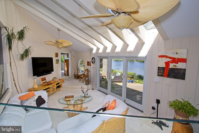 11566 Lake Newport Rd, Reston, VA 20194 - living area with a skylight, vaulted ceiling, a ceiling fan, and wood walls