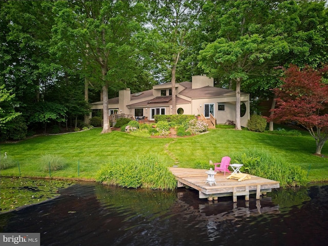 11566 Lake Newport Rd, Reston, VA 20194 - back of property with stucco siding, a yard, and a water view