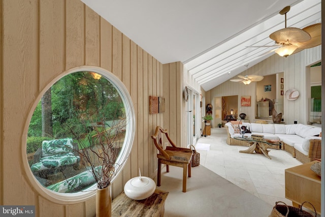 11566 Lake Newport Rd, Reston, VA 20194 - living area with lofted ceiling, ceiling fan, and wooden walls