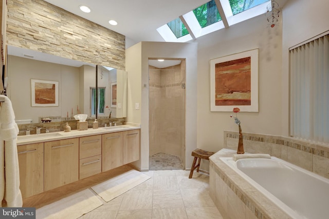 11566 Lake Newport Rd, Reston, VA 20194 - full bathroom featuring a skylight, a bath, double vanity, tiled shower, and recessed lighting