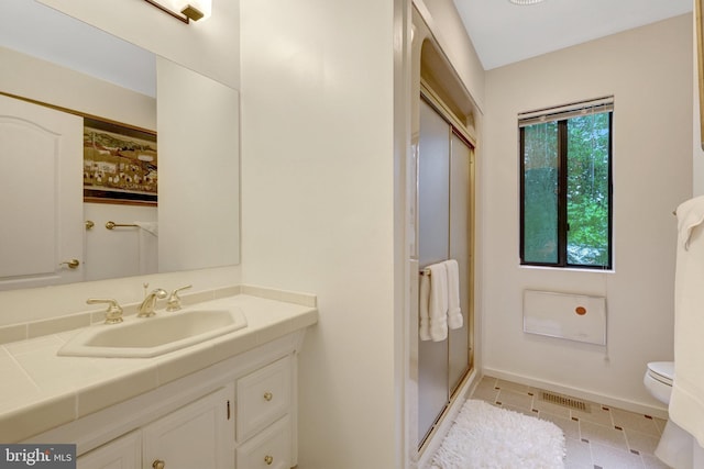 11566 Lake Newport Rd, Reston, VA 20194 - full bathroom with vanity, toilet, a shower stall, and baseboards