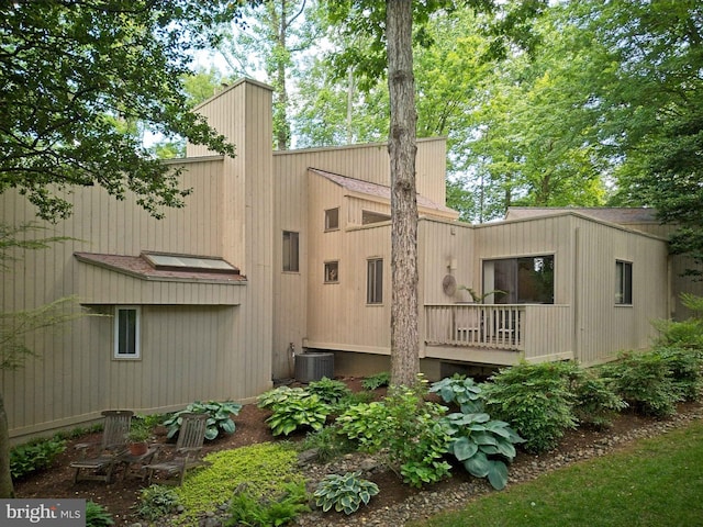 11566 Lake Newport Rd, Reston, VA 20194 - back of property featuring central AC and a chimney