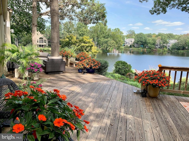 11566 Lake Newport Rd, Reston, VA 20194 - wooden deck featuring a water view and view of wooded area