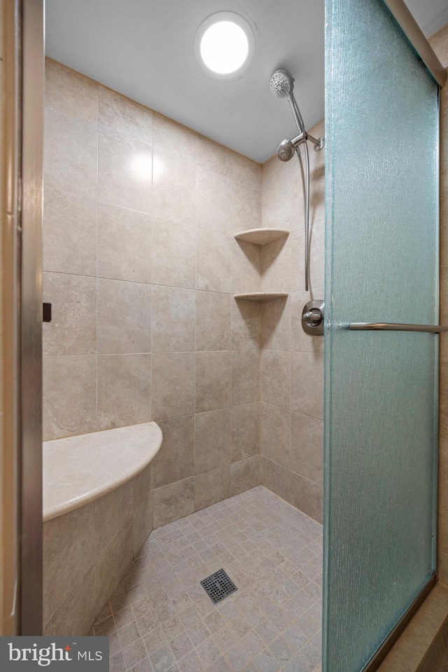 bathroom with a shower stall