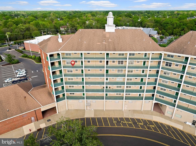exterior space featuring a wooded view