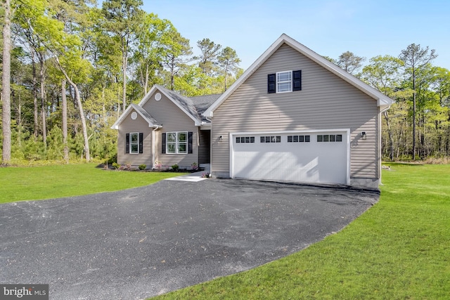 traditional-style home with a front lawn and aphalt driveway