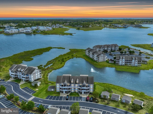 aerial view at dusk with a water view