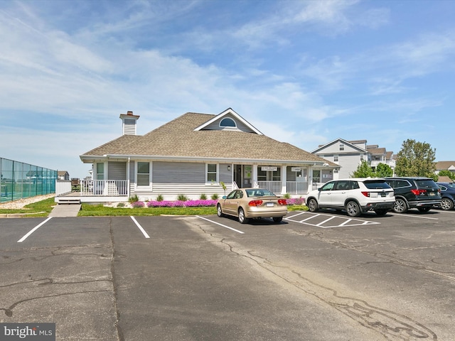 view of building exterior featuring uncovered parking