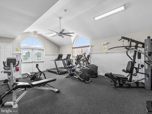 exercise room with ceiling fan and lofted ceiling