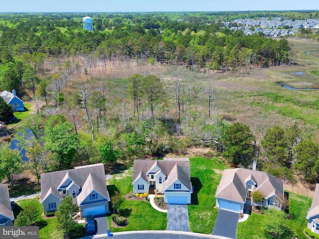 bird's eye view with a residential view and a wooded view