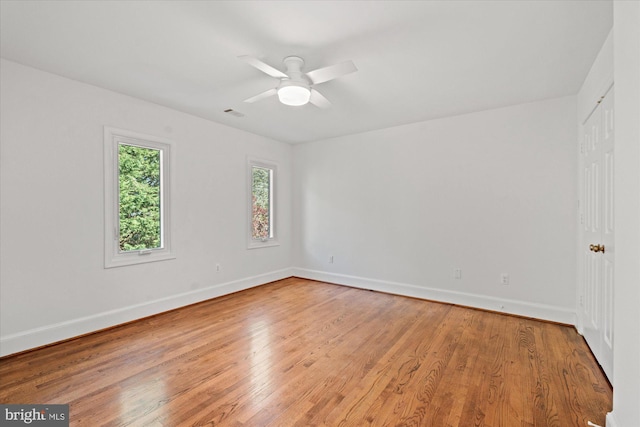 3233 Ellicott St NW, Washington, DC 20008 - spare room featuring baseboards, light wood-type flooring, and a ceiling fan