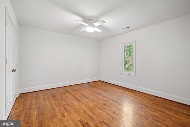 3233 Ellicott St NW, Washington, DC 20008 - unfurnished bedroom with baseboards, ceiling fan, visible vents, and wood finished floors