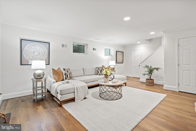 3233 Ellicott St NW, Washington, DC 20008 - living area featuring wood finished floors, crown molding, visible vents, baseboards, and recessed lighting