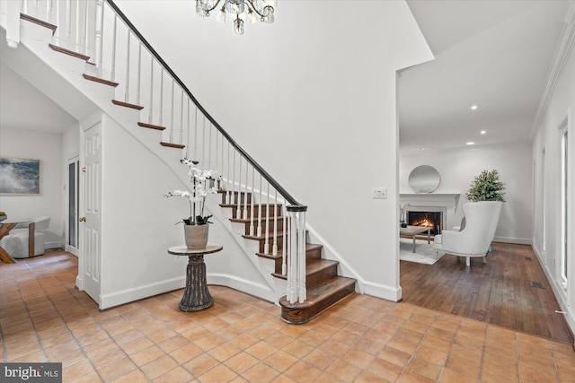 3233 Ellicott St NW, Washington, DC 20008 - foyer entrance featuring baseboards, stairs, recessed lighting, and a warm lit fireplace