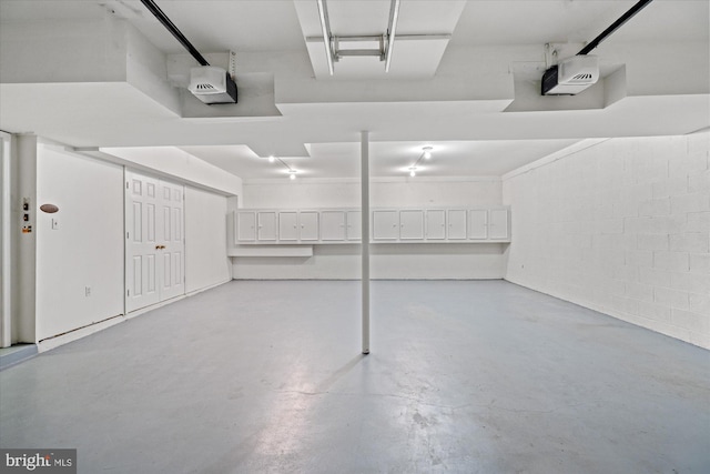 3233 Ellicott St NW, Washington, DC 20008 - garage with concrete block wall and a garage door opener