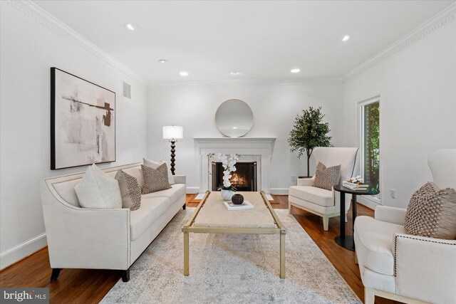 3233 Ellicott St NW, Washington, DC 20008 - living room with ornamental molding, visible vents, and wood finished floors