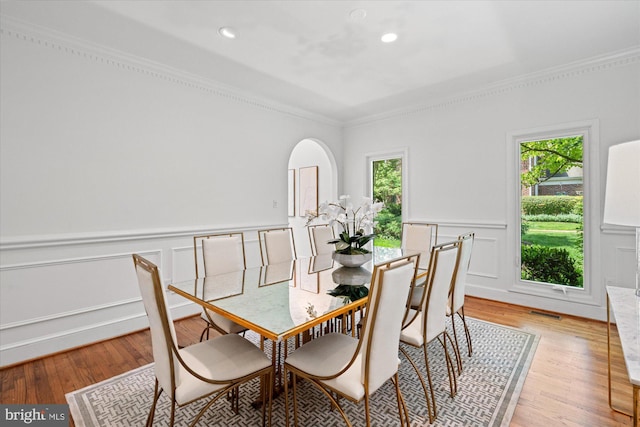 3233 Ellicott St NW, Washington, DC 20008 - dining area featuring visible vents, crown molding, a wainscoted wall, and wood finished floors