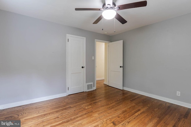 1724 E Branch Rd, State College, PA 16801 - unfurnished room with baseboards, wood finished floors, and a ceiling fan
