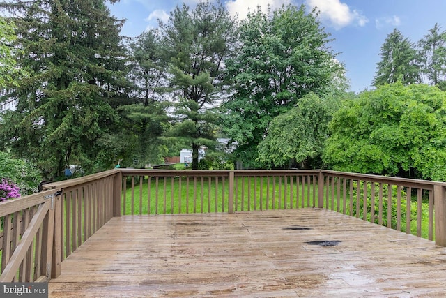 1724 E Branch Rd, State College, PA 16801 - deck featuring a lawn and view of wooded area
