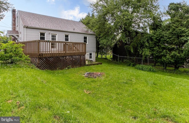 1724 E Branch Rd, State College, PA 16801 - back of house with a deck, a chimney, roof with shingles, and a lawn