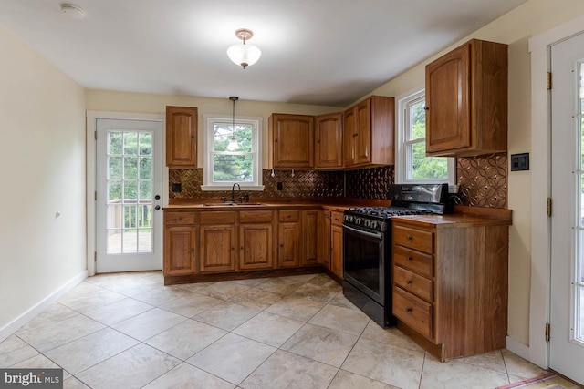 1724 E Branch Rd, State College, PA 16801 - kitchen with stainless steel range with gas stovetop, brown cabinets, and tasteful backsplash