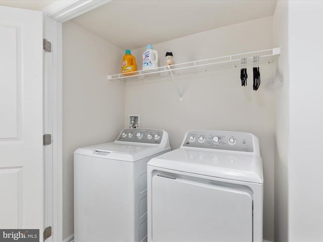 laundry area with separate washer and dryer and laundry area