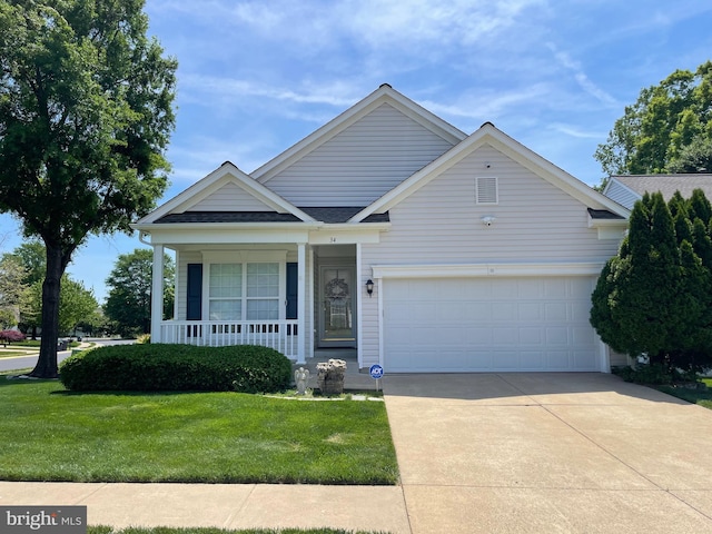 34 Dayton Cir, Fredericksburg, VA 22406 - view of front facade with concrete driveway, a front yard, an attached garage, covered porch, and roof with shingles