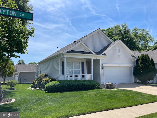 34 Dayton Cir, Fredericksburg, VA 22406 - view of front of property with a porch, concrete driveway, a front yard, and a shingled roof