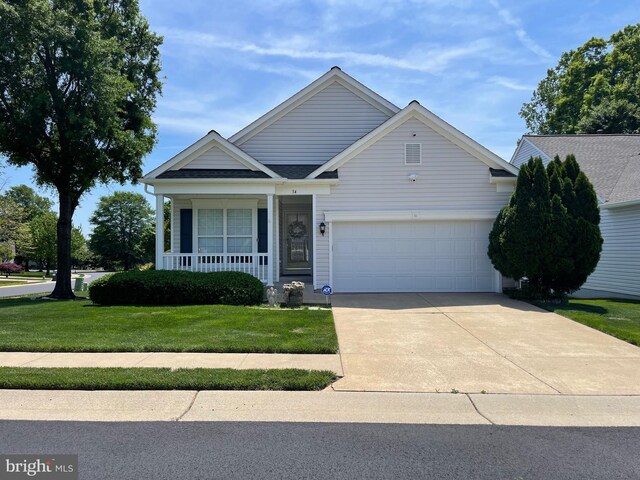 34 Dayton Cir, Fredericksburg, VA 22406 - view of front of home featuring concrete driveway, a front yard, a porch, and a garage