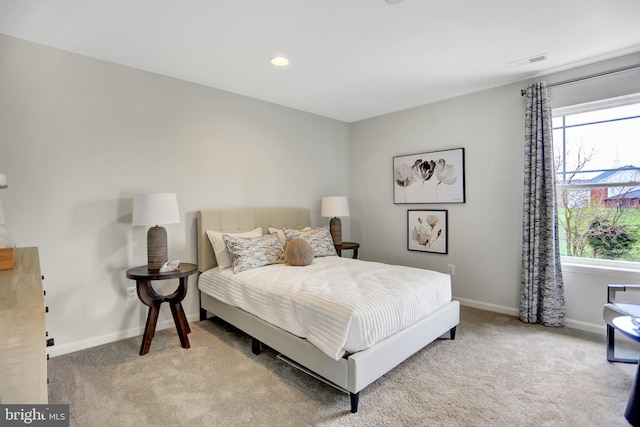 carpeted bedroom with visible vents, recessed lighting, baseboards, and multiple windows