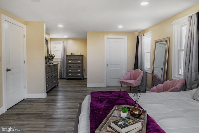 bedroom with baseboards, recessed lighting, and dark wood-style floors