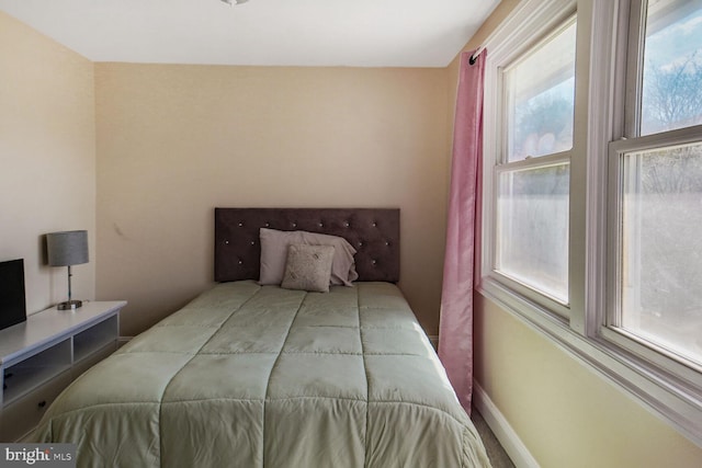 bedroom featuring baseboards