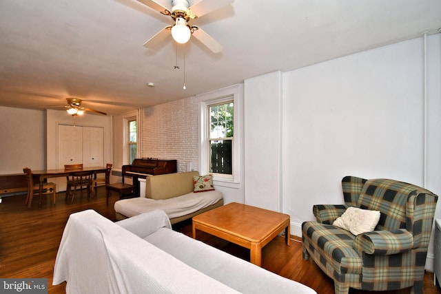 living area featuring ceiling fan and wood finished floors