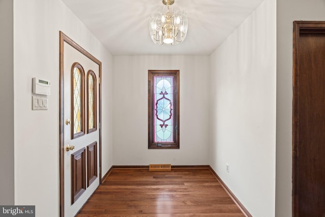 4 Sunflower Ct, Newtown, PA 18940 - foyer entrance featuring a chandelier, wood finished floors, and baseboards