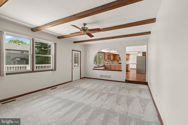 4 Sunflower Ct, Newtown, PA 18940 - unfurnished living room featuring carpet, beam ceiling, baseboards, and a ceiling fan