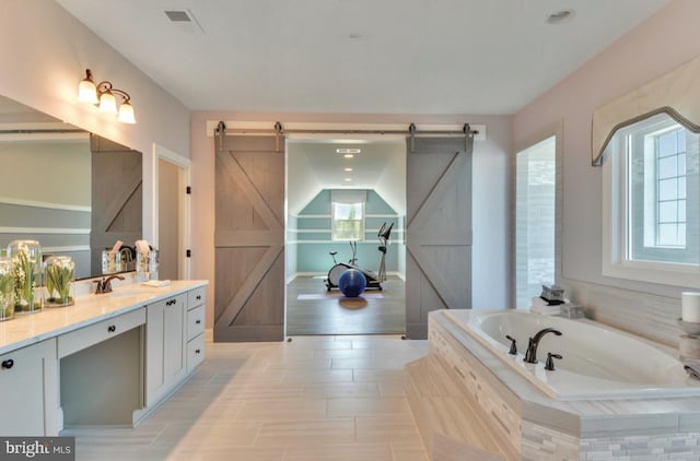17905 Queen Anne Rd, Upper Marlboro, MD 20774 - bathroom with plenty of natural light, a bath, visible vents, and vanity