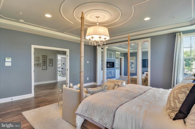 17905 Queen Anne Rd, Upper Marlboro, MD 20774 - bedroom with an inviting chandelier, decorative columns, wood finished floors, baseboards, and a tray ceiling