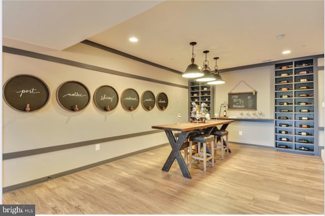 17905 Queen Anne Rd, Upper Marlboro, MD 20774 - dining room with recessed lighting, baseboards, wood finished floors, and a bar