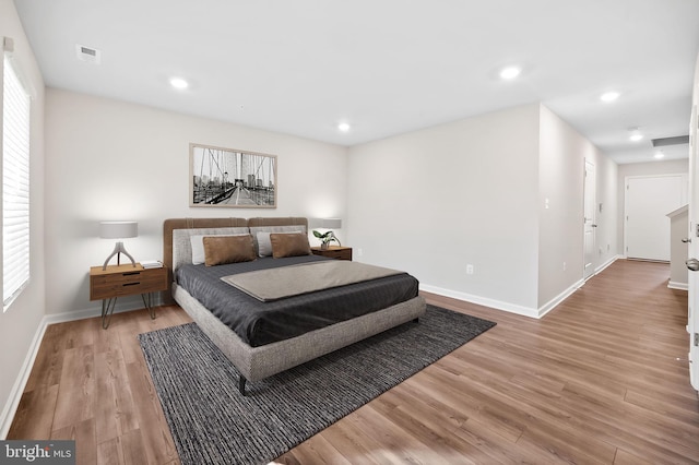 bedroom with visible vents, recessed lighting, baseboards, and light wood-style floors