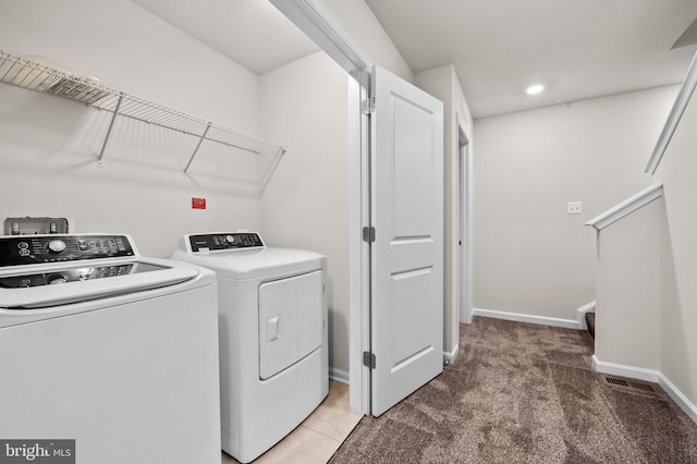 laundry area with laundry area, light carpet, recessed lighting, baseboards, and washing machine and dryer