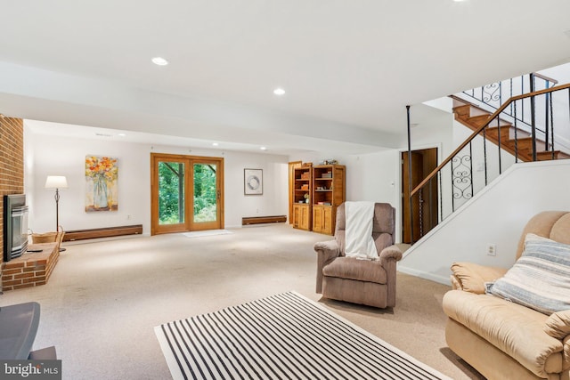 1406 Catlyn Pl, Annapolis, MD 21401 - carpeted living room with a baseboard radiator, stairs, recessed lighting, and a brick fireplace