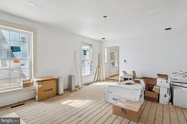 interior space featuring visible vents and hardwood / wood-style flooring