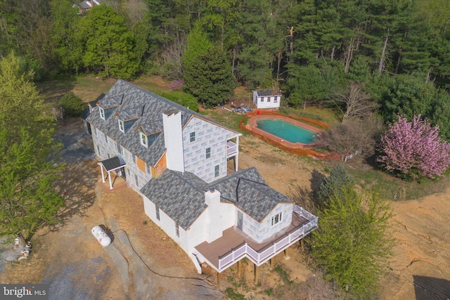aerial view with a wooded view