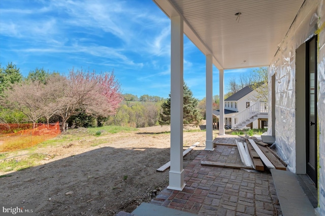 view of patio / terrace featuring stairs