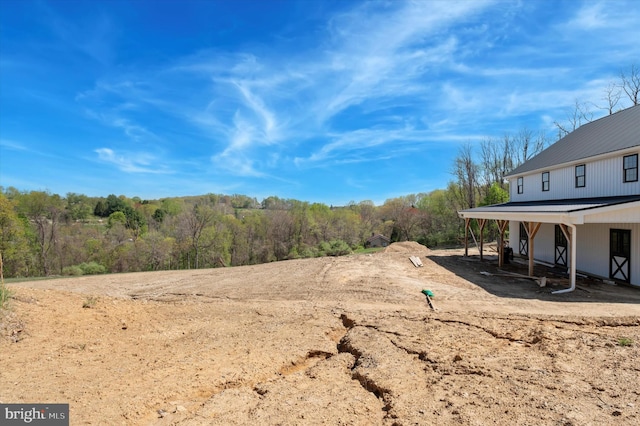 view of yard with a wooded view