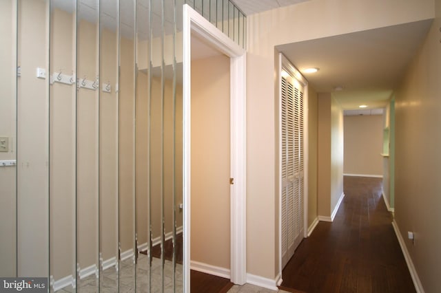 hallway with recessed lighting, baseboards, and hardwood / wood-style floors