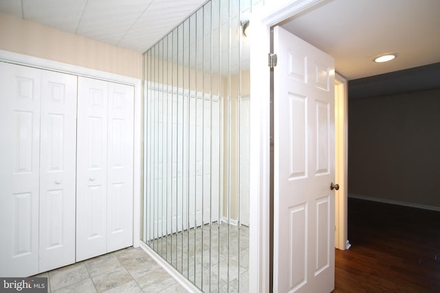 bathroom featuring baseboards and recessed lighting