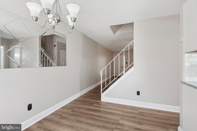 4927 Oxford Ct, Bensalem, PA 19020 - interior space with baseboards, an inviting chandelier, and wood finished floors