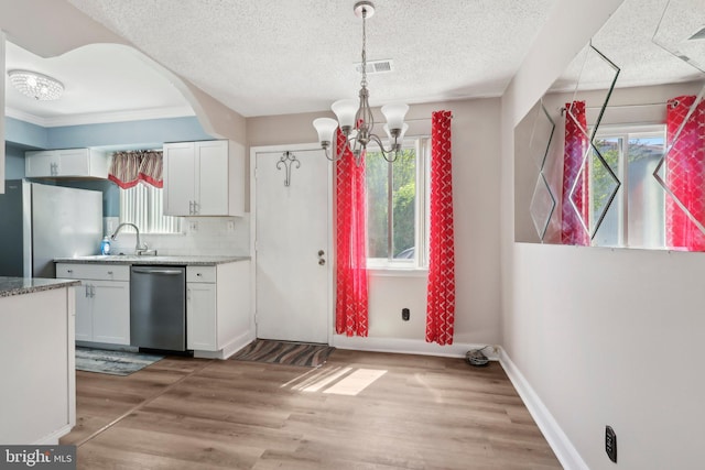 4927 Oxford Ct, Bensalem, PA 19020 - kitchen featuring a healthy amount of sunlight, appliances with stainless steel finishes, and white cabinetry